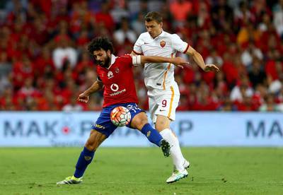 Hossam Ghaly of Al Ahly competes for the ball with Edin Dzeko of AS Roma during the friendly match between AS Roma and Al Ahly on May 20, 2016 in Al Ain. (Francois Nel/Getty Images)