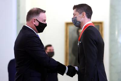 Bayern Munich's Polish striker Robert Lewandowski receives the Commander's Cross of the Order of Polonia Restituta. EPA