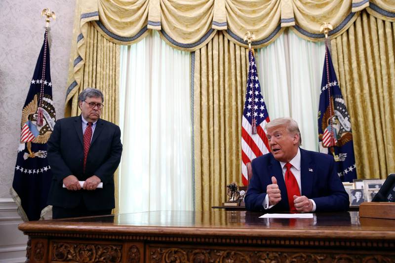 FILE - In this June 15, 2020, file photo President Donald Trump speaks alongside Attorney General William Barr during a law enforcement briefing on the MS-13 gang in the Oval Office of the White House in Washington. Barr is scheduled to appear for the first time before the House Judiciary CommitteeÂ on Tuesday, July 28.  (AP Photo/Patrick Semansky, File)