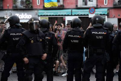 Spanish police stand in front of protesters during an anti-Nato demonstration near Tirso de Molina square in Madrid. AFP