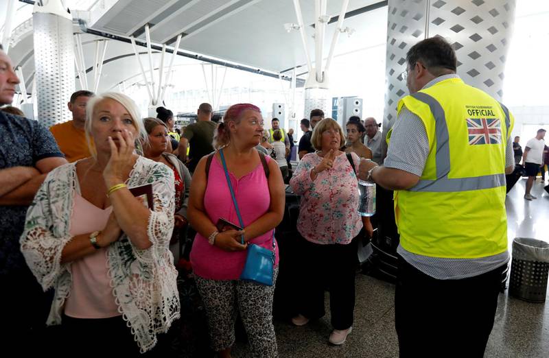 Passengers are seen at Thomas Cook check-in points at Enfidha-Hammamet International Airport, Tunisia. Reuters