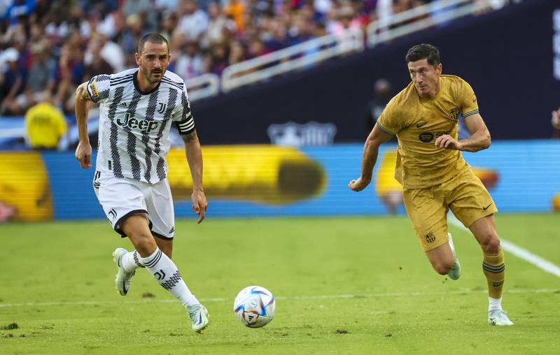 Barcelona forward Robert Lewandowski competes for the ball with Juventus defender Leonardo Bonucci. USA Today