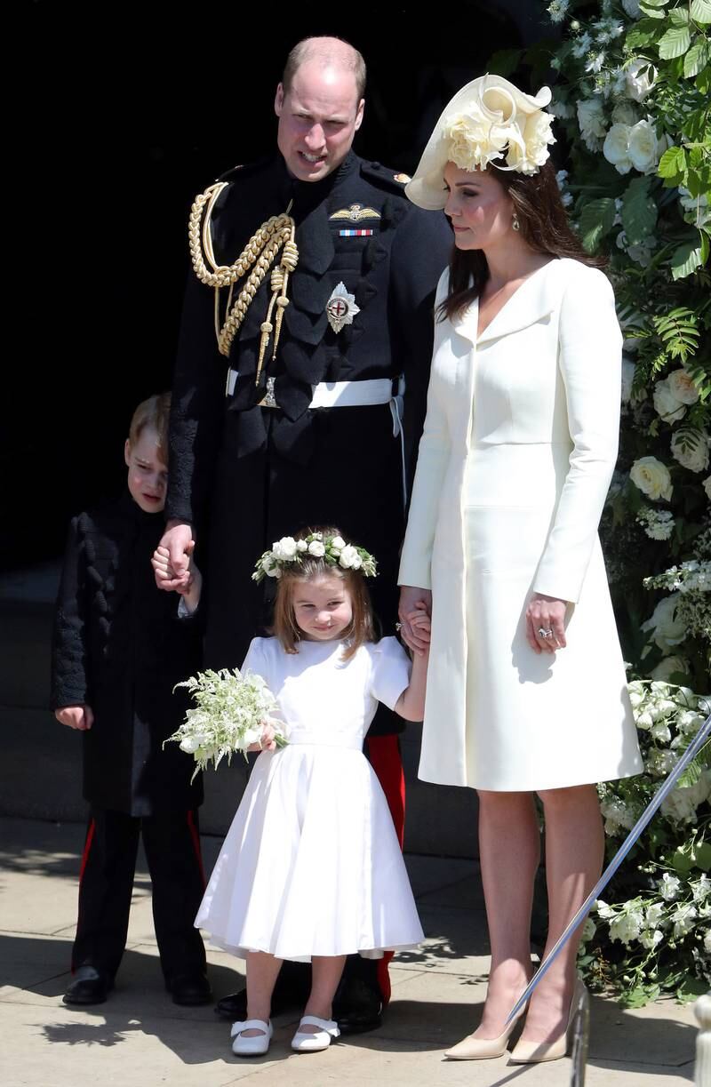Prince William and Kate, with Prince George and Princess Charlotte, leave St George's Chapel, Windsor Castle, after the wedding of Prince Harry and Meghan Markle in May 2018.