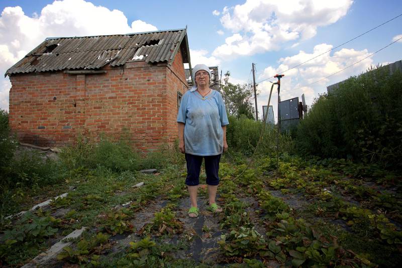 Alexandra Nagaradnuk - Simonovka
When the shelling started I mostly lived in the cellar. I lived there for about a month and survived off eggs from my hens and strawberries from my garden which I also sold and bought bread. I thought I would die in that basement. I used to speak to god all the time, and pray for him to help me. I left for  a safer village and came back when the Ukrainian Army came back. I don’t know when that was, the days just roll into each other now. This time last year I was preserving vegetables for the winter, now look; there are mines and unexploded ordinance in my garden. I never thought war would come here, this is just a nice, quiet district of Slavyansk. Whenever I hear a plane I get frightened and sometimes it’s just my imagination and there are no planes. But I’m still frightened. But I have to rebuild my house and garden. It’s everything I worked for in my live. 