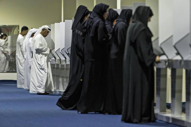 Voters cast their ballots in the 2015 Federal National Council election at the Fujairah FNC voting station. Antonie Robertson / The National