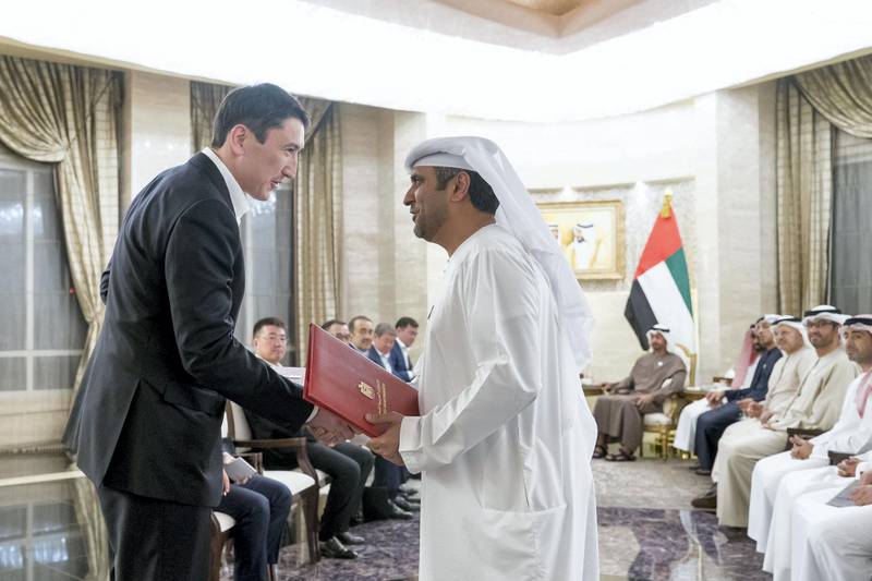 ABU DHABI, UNITED ARAB EMIRATES - March 14, 2019: HH Sheikh Mohamed bin Zayed Al Nahyan, Crown Prince of Abu Dhabi and Deputy Supreme Commander of the UAE Armed Forces (not shown) and HE Nursultan Nazarbayev, President of Kazakhstan (not shown), witness an MOU signing ceremony at Al Shati Palace. Seen signing on behalf of the UAE is Prime Project Development Consultancy (R) with Ministry of Energy of Kazakhstan (L).

( Rashed Al Mansoori / Ministry of Presidential Affairs )
---