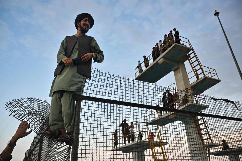Men gather on diving platforms at the unused swimming pool atop Wazir Akbar Khan Hill, in Afghanistan's capital Kabul. AFP

