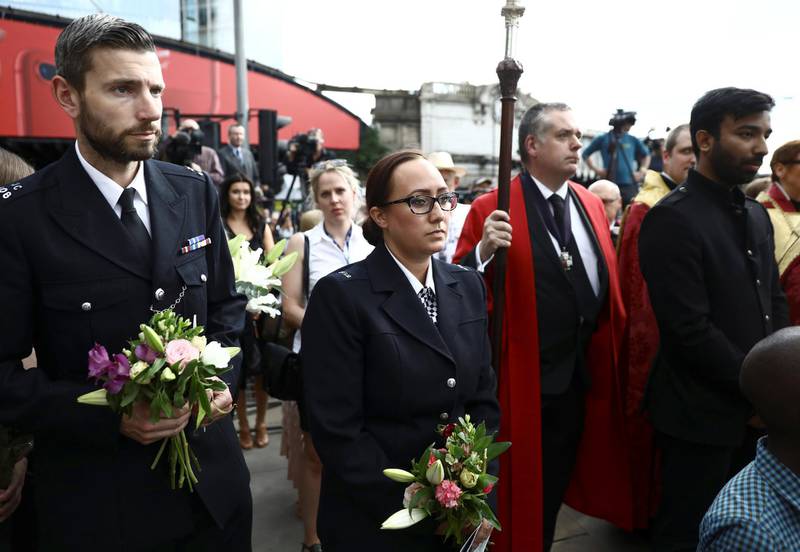 Police officers attend commemorations of the first anniversary of the attack on London Bridge. REUTERS/Simon Dawson