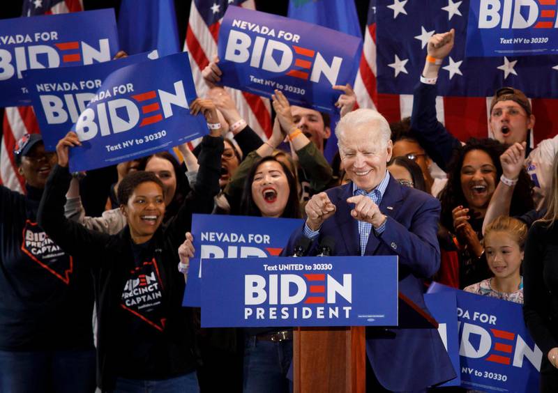 epa08468181 US Democratic presidential candidate, former Vice President Joe Biden (C, front), reacts as he addresses supporters during his Nevada post-caucus rally in Las Vegas, Nevada, USA, 22 February 2020 (reissued 06 June 2020). According to media reports on 06 June 2020, Biden officially secured the Democratic Party presidential nomination after receiving the required number of delegates via state primaries. Biden has campaigned mainly from his home due to the ongoing coronavirus pandemic.  EPA/EUGENE GARCIA