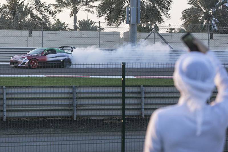 People watching the drift show in Abu Dhabi as part of National Day celebrations. Mona Al Marzooqi/ The National