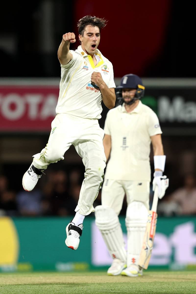 Australia captain Pat Cummins celebrates taking the wicket of Ollie Pope for five. Getty