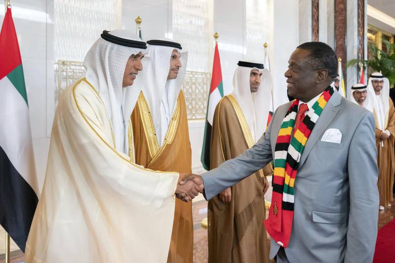 ABU DHABI, UNITED ARAB EMIRATES - March 16, 2019:  HE Jaber Al Suwaidi, General Director of the Crown Prince Court - Abu Dhabi (L) greets HE Emmerson Mnangagwa, President of Zimbabwe (R), during a reception at the Presidential Airport. 

( Ryan Carter for the Ministry of Presidential Affairs )
---