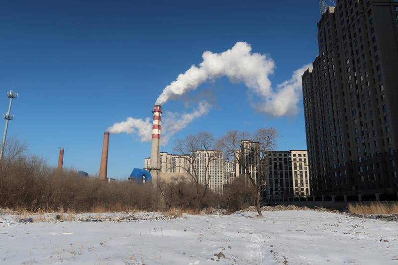 FILE PHOTO: A coal-fired heating complex is seen behind the ground covered by snow in Harbin, Heilongjiang province, China November 15, 2019. Picture taken November 15, 2019.  REUTERS/Muyu Xu/File Photo