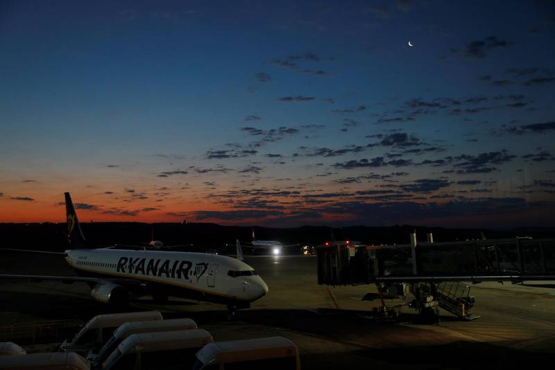The moon is seen over a Ryanair plane at the Adolfo Suarez Madrid Barajas airport in Madrid, Spain. Reuters