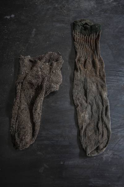 A mismatched pair of socks recovered with human remains exhumed at the gravesite