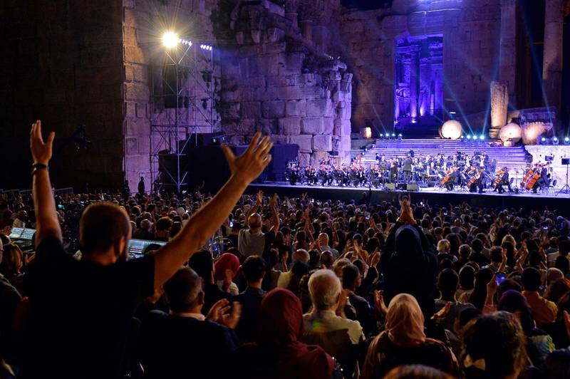 Fans attend a concert of Palestinian singer Mohammed Assaf as he performs on stage during the annual Baalbeck International Festival in Beqaa Valley, Lebanon. EPA