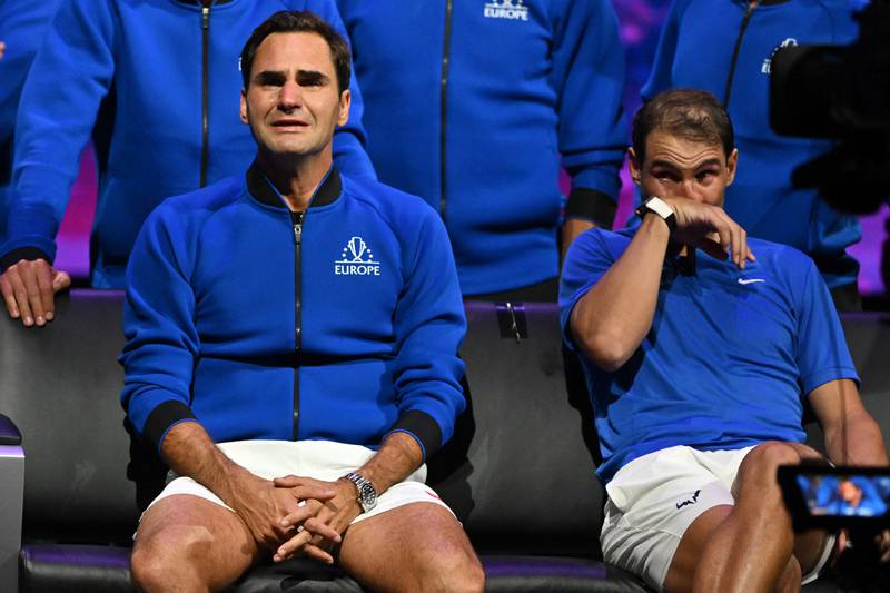 Switzerland's Roger Federer, left, sheds a tear after playing his last match, a doubles game with Spain's Rafael Nadal, right, on September 24. AFP
