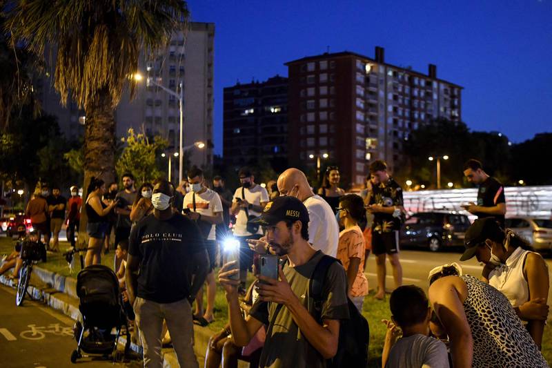 Supporters gather in front of the Camp Nou stadium in Barcelona on Thursday evening. Lionel Messi will end his 20-year career with Barcelona after the Argentine superstar failed to reach agreement on a new deal with the club.