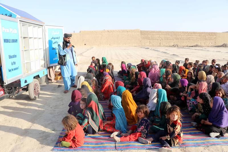 Afghan children attend an educational event organised by Pen Path, a civil society initiative providing education to Afghan children in areas where there is no school, in Kandahar, Afghanistan. 