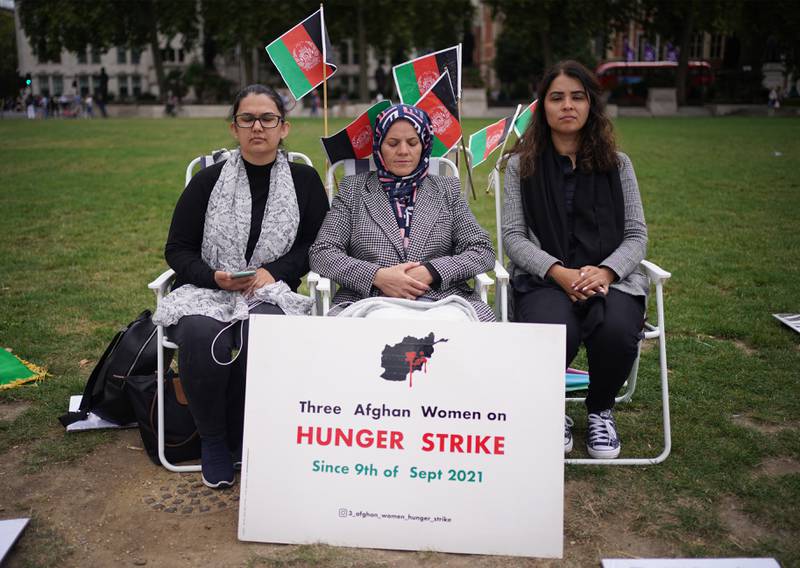Three Afghan women have been on hunger strike since Thursday in protest against the Taliban takeover of Afghanistan and have kept a vigil in Parliament Square, London. PA
