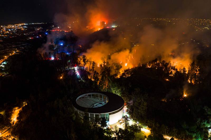 A forest fire rages in Vina del Mar, in Valparaiso region, Chile. More than 100 houses were destroyed or damaged by the blaze. AFP
