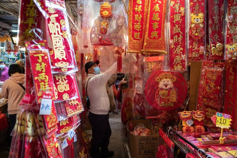 People shop for Lunar New Year items in a street market in Hong Kong, China. EPA