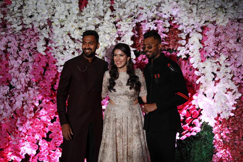 Indian cricketer Krunal Pandya (L), his wife Pankhuri (C) and cricketer Hardik Pandya (R). Photo: EPA
