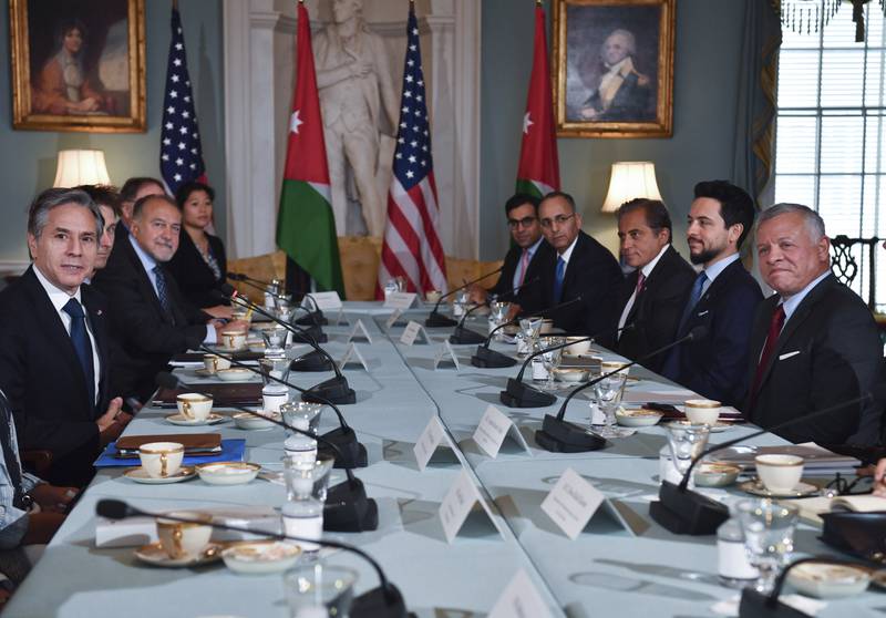 At the State Department in Washington, US Secretary of State Antony Blinken, left, meets Jordan's King Abdullah II, right, as Jordan's Crown Prince Hussein, second right, looks on.