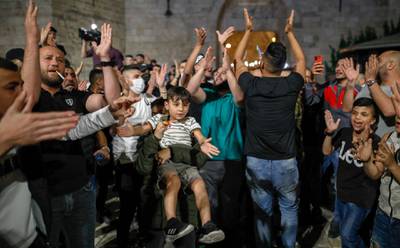 Palestinian protesters shout slogans at the Damascus Gate in Jerusalem's Old City. AFP