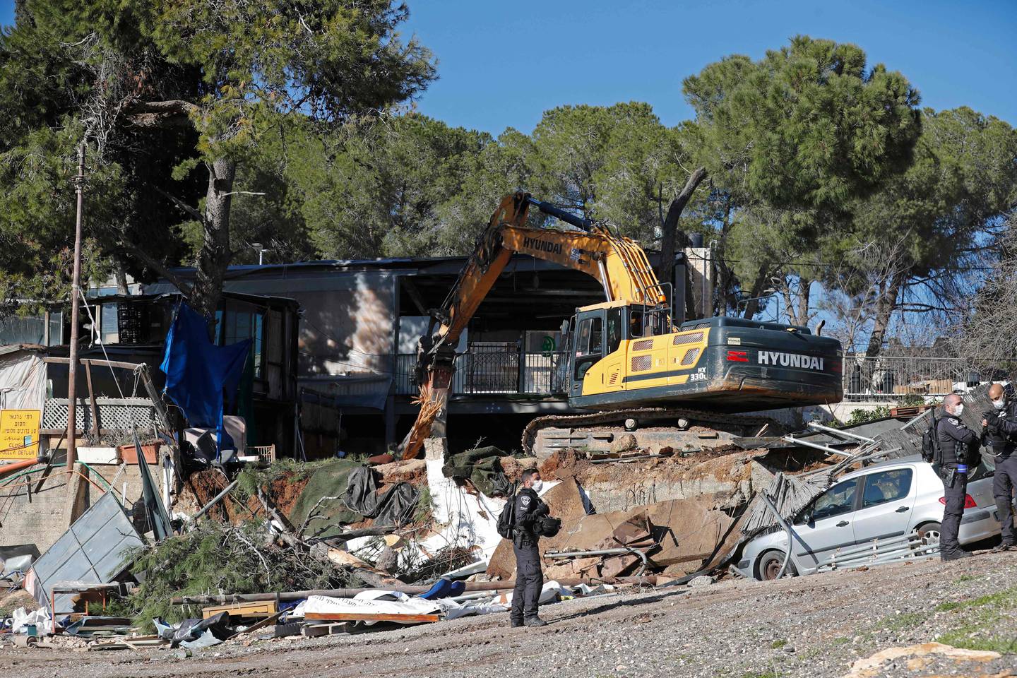 An excavator near the house in Sheikh Jarrah on Monday. AFP