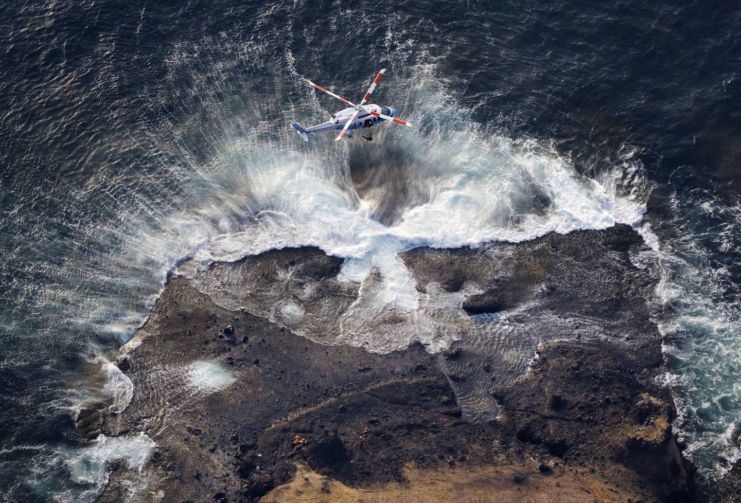 A Japan Coast Guard helicopter conducting a search and rescue operation. Reuters