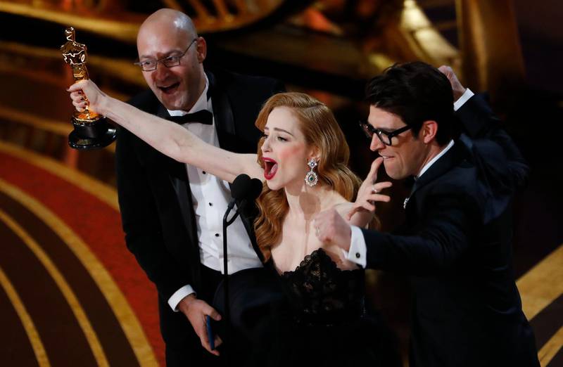 Skin's Guy Nattiv and Jaime Ray Newman celebrate with their Oscar for Best Live Action Short Film. Reuters