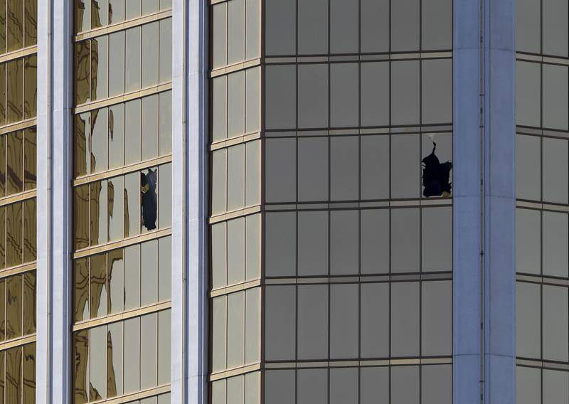 The damaged windows on the 32nd floor room that was used by the shooter in the Mandalay Hotel after a gunman killed at least 58 people and wounded more than 500 others when he opened fire on a country music concert in Las Vegas, Nevada. Mark Ralston / AFP