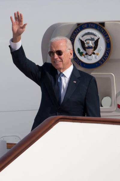 BEIJING, CHINA - DECEMBER 04:  U.S. Vice President Joe Biden waves as he walks out of Air Force Two at the airport December 4, 2013 in Beijing, China. Biden is on the first leg of his week-long visit to Asia. (Photo by Ng Han Guan-Pool/Getty Images)