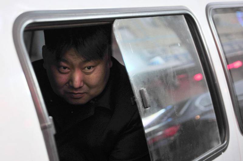 Xia, a 38-year-old lookalike of North Korean leader Kim Jong Un, looks out from a vehicle near his street food stall in Shenyang, Liaoning province. Reuters / March 22