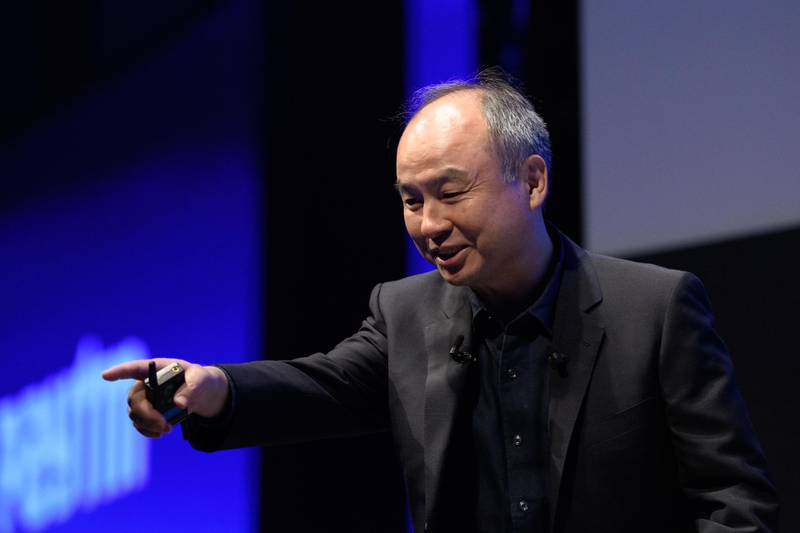 Masayoshi Son, chairman and chief executive officer of SoftBank Group Corp., gestures to the crowd as he speaks during the SoftBank World 2019 event in Tokyo, Japan, on Thursday, July 18, 2019. The founders of Southeast Asian ride-hailing giant Grab, indoor farming startup Plenty, Indian hotel chain OYO Rooms and payments service Paytm took the stage at an annual SoftBank conference to explain how artificial intelligence helps them stay on top in their respective fields. Photographer: Akio Kon/Bloomberg