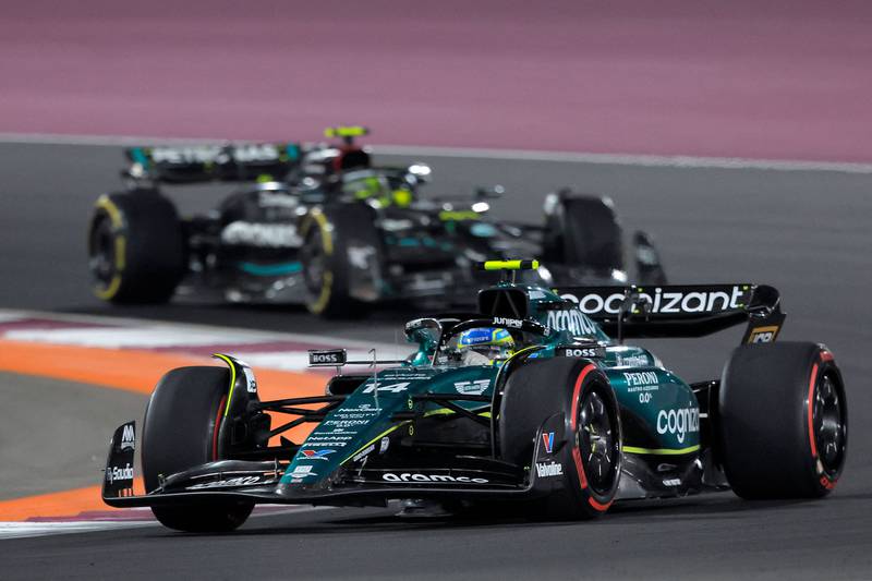 Aston Martin's Fernando Alonso leads Mercedes driver Lewis Hamilton during the sprint race ahead of the Qatari Formula One Grand Prix at the Lusail International Circuit. AFP