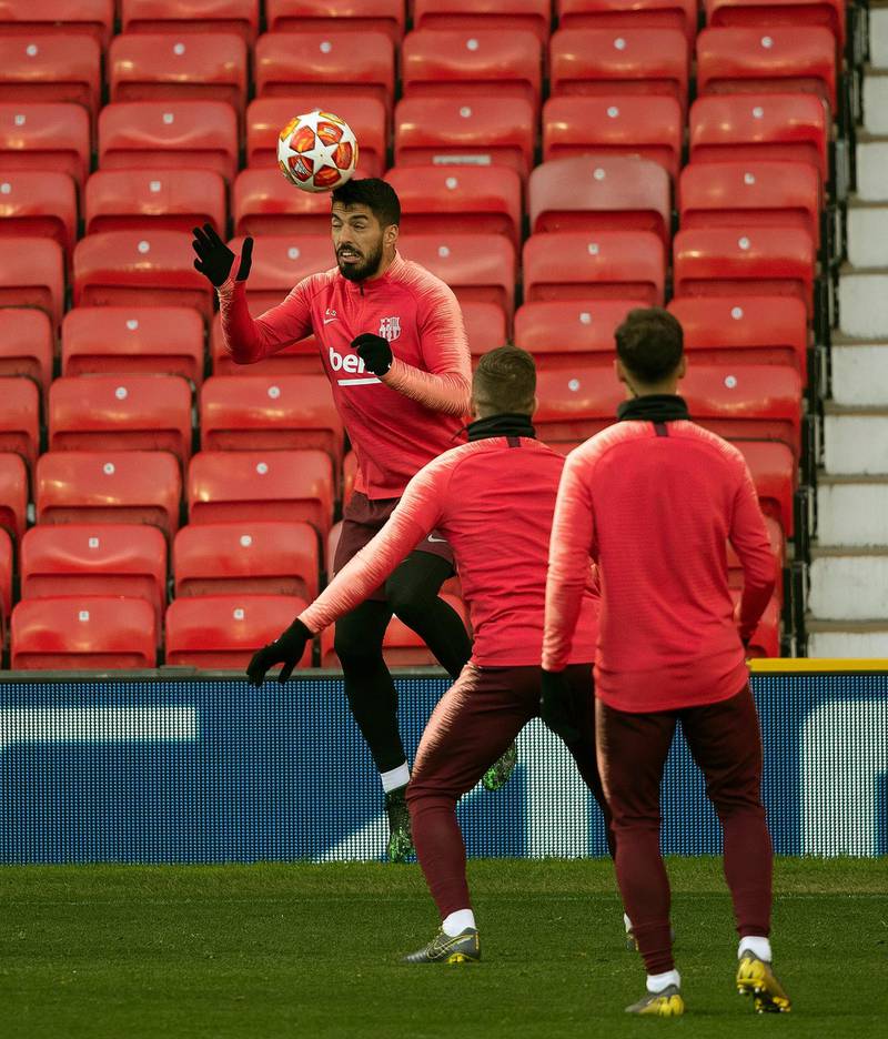 Barcelona's Luis Suarez, left, during the training session at Old Trafford, Manchester. AP