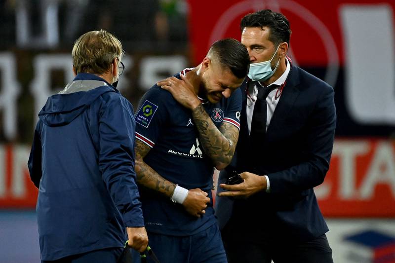 PSG Argentinian forward Mauro Icardi leaves the pitch after picking up an injury. AFP