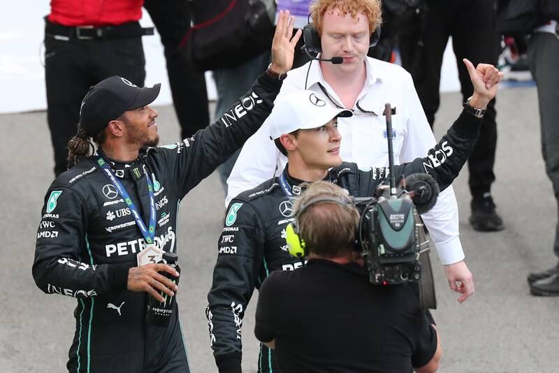 Lewis Hamilton and George Russell wave to the crowd after the sprint race. EPA