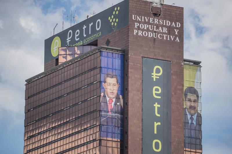 epa06957103 View of images from late Venezuelan President Hugo Chavez (L), current President Nicolas Maduro (R) and Petro's crypto-currency logo (C) hang on a building in Caracas, Venezuela, 18 August 2018.  There is unease and confusion among the population as new measures of President Nicolas Maduroâ€™s economic plans will go into effect on 20 August. The â€˜Bolivar Soberanoâ€™ currency will be the new official currency and the crypto-currency Petro will be a valid secondary currency.  EPA/MIGUEL GUTIERREZ