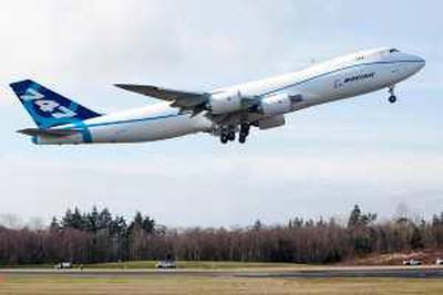EVERETT, WA - FEBRUARY 8: The Boeing 747-8 freighter makes its first test flight February 8, 2009 at Paine Field in Everett, Washington. The 747-8 is the largest jumbo jet Boeing has built.   Stephen Brashear/Getty Images/AFP== FOR NEWSPAPERS, INTERNET, TELCOS & TELEVISION USE ONLY == *** Local Caption ***  807158-01-10.jpg *** Local Caption ***  807158-01-10.jpg
