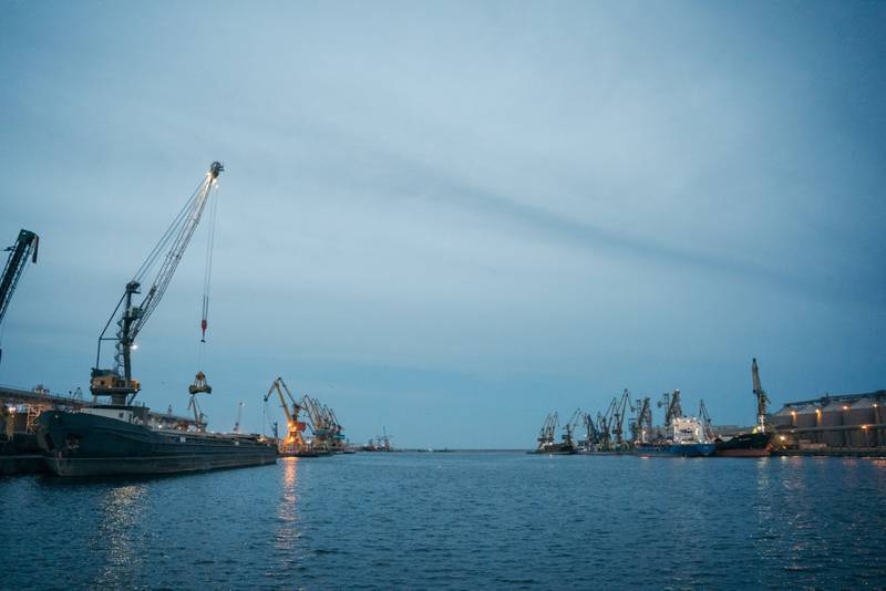 A bulk carrier, left, and tankers moored at docks in the Port of Constanta in Constanta, Romania, on Saturday, May 7, 2022.  Russia’s blockade of sea ports around Odesa is forcing trade to reroute through the Romanian port and Ukraine’s smaller Danube river ports, while trucks now have to drive through Moldova to get from one part of the country to the other, or to and from the Romanian border. Photographer: Andrei Pungovschi / Bloomberg