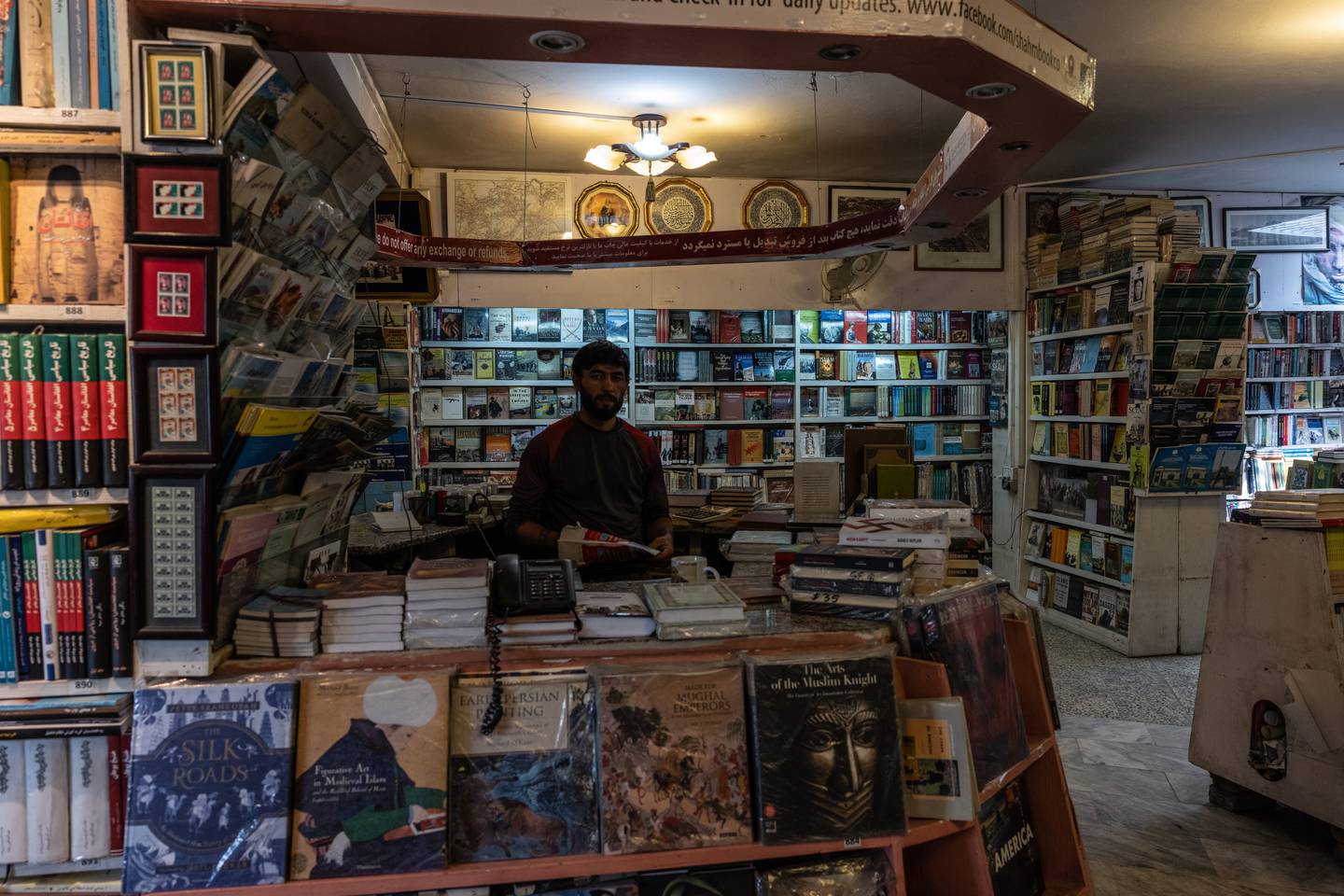 Ahmad Shah, 29, inside the Kabul bookstore. Stefanie Glinski for The National