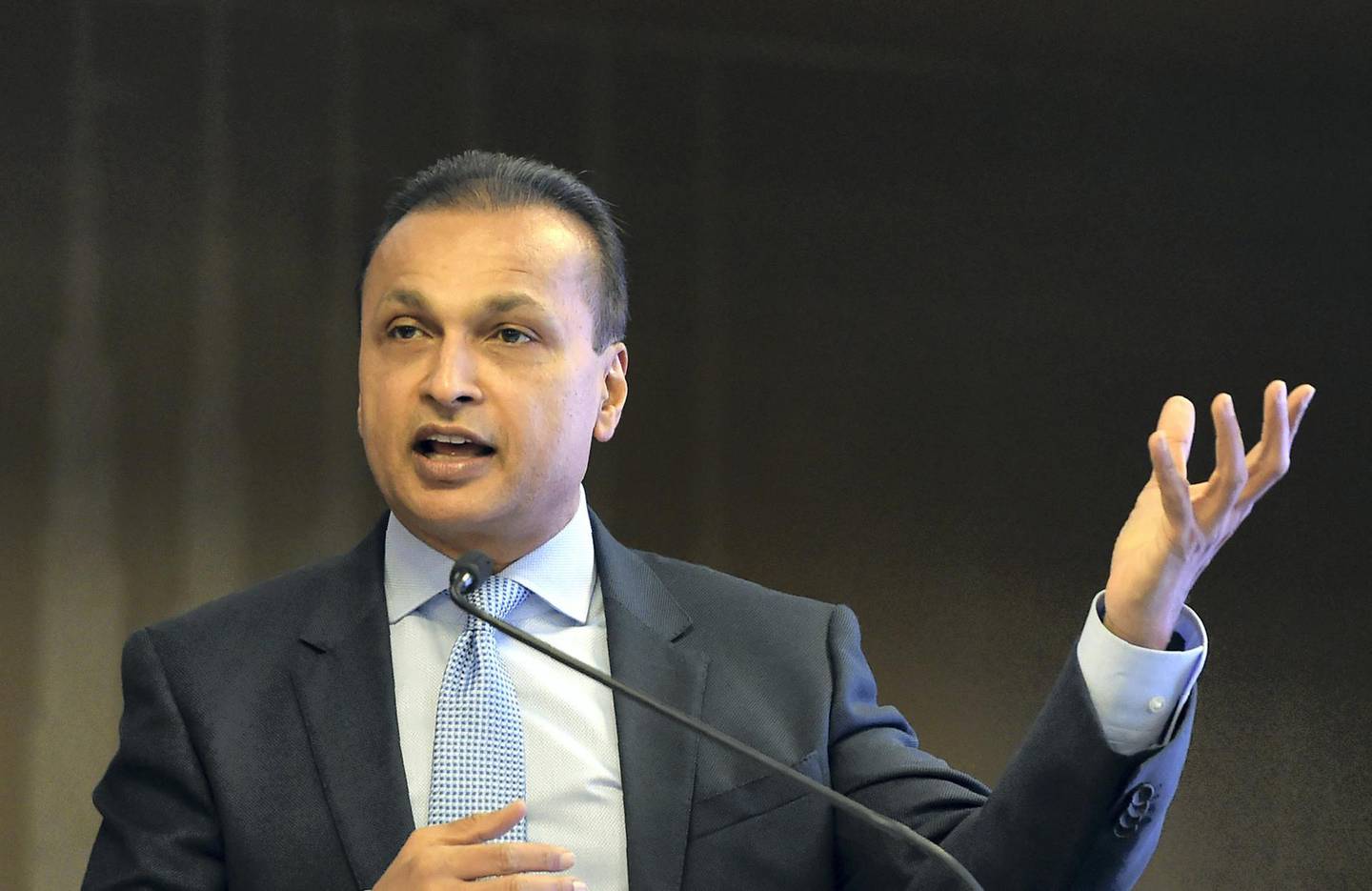 Indian industrialist and Reliance ADAG CEO Anil Ambani speaks during a news conference in Mumbai on June 2, 2017. - Indian billionaire Anil Ambani insisted June 2 that debt-saddled Reliance Communications had a bright future as he moved to reassure investors who are worried that the telecoms company is close to defaulting on loans. (Photo by PUNIT PARANJPE / AFP)