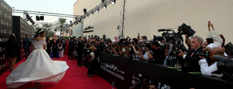 Saudi actress Fay Fouad walks the red carpet for the closing ceremony of the first Red Sea Film Festival. AFP