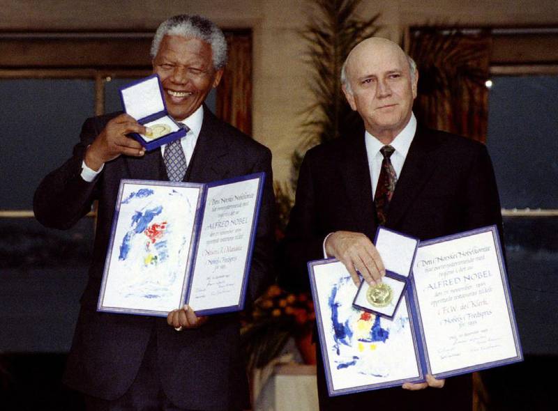 December 10, 1993: South African President FW de Klerk, right, and Mandela, left, hold up medals and certificates after they were jointly awarded the 1993 Nobel Peace Prize at a ceremony in Oslo. Reuters