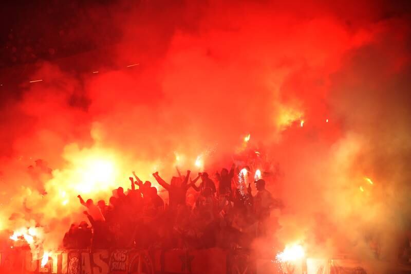 Fans set off flares at the Johan Cruyff Arena. Getty