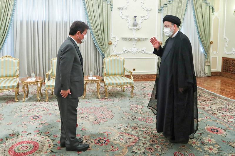 Iranian President Ebrahim Raisi meets Japanese Foreign Minister Toshimitsu Motegi in Tehran on Sunday. AFP / Iranian Presidency