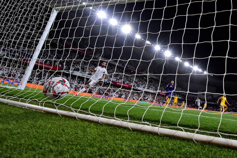Ali Mabkhou slots the winning goal into the empty net. AFP